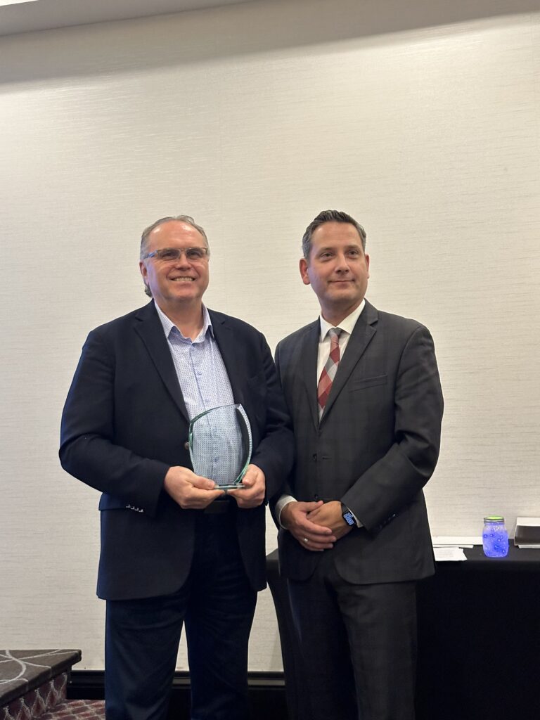 (Left) Ruben Wollmann, Executive Director of West Park Manor accepting MSEN Best Practices in Diversity Employment - Large Business (Winnipeg) from Winnipeg Chamber of Commerce President & CEO, (Right) Loren Remillard.